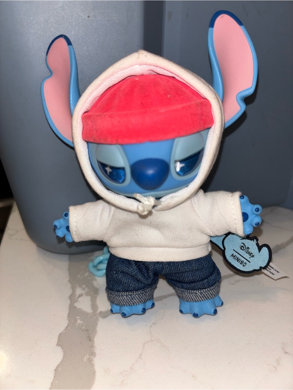 Disney Blue Stitch Figure with White Hoodie and Red Cap